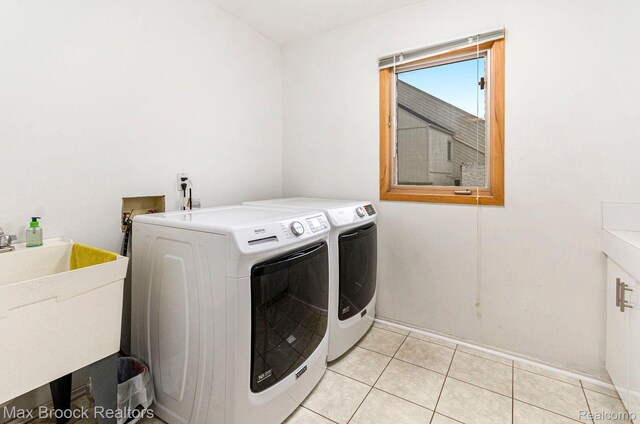 5322 Pond Bluff Dr, West Bloomfield, MI 48323 - washroom featuring washer and clothes dryer and light tile patterned flooring