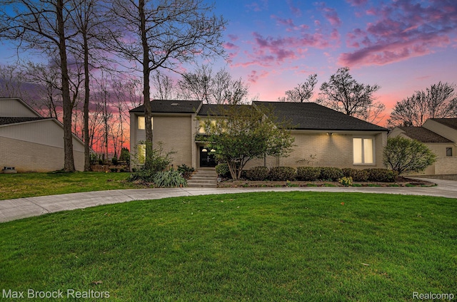 5322 Pond Bluff Dr, West Bloomfield, MI 48323 - mid-century modern home with a front lawn, brick siding, and curved driveway