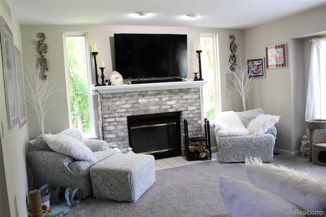 14361 Blue Heron Dr, Fenton, MI 48430 - living area with plenty of natural light, a fireplace, and carpet flooring