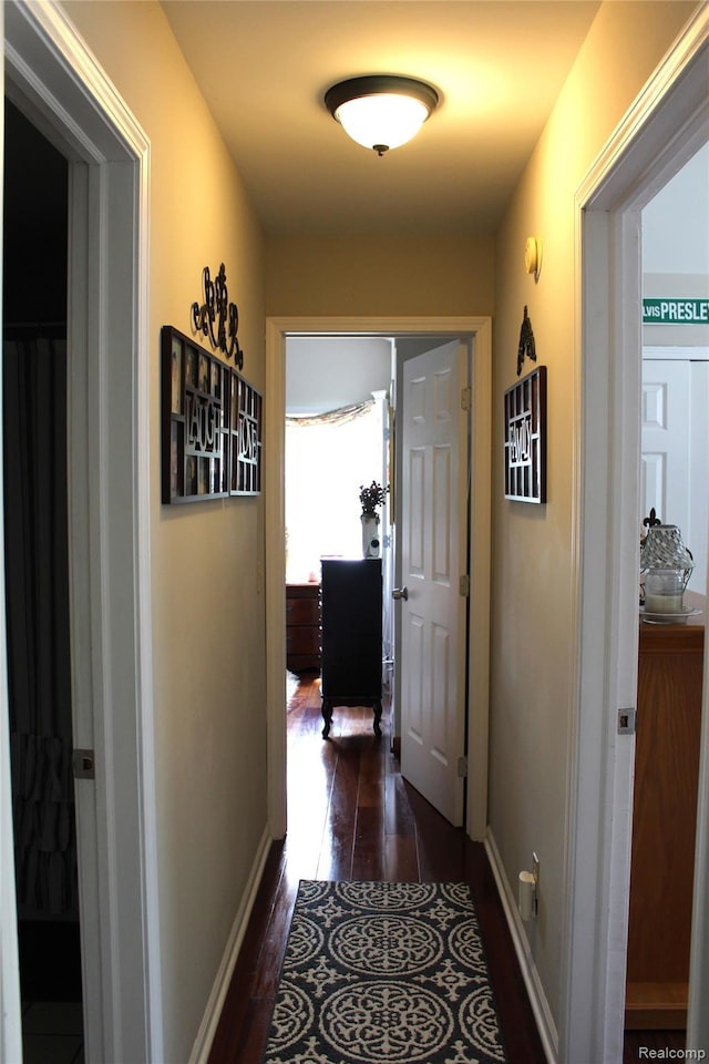 14361 Blue Heron Dr, Fenton, MI 48430 - corridor featuring dark wood-style flooring and baseboards