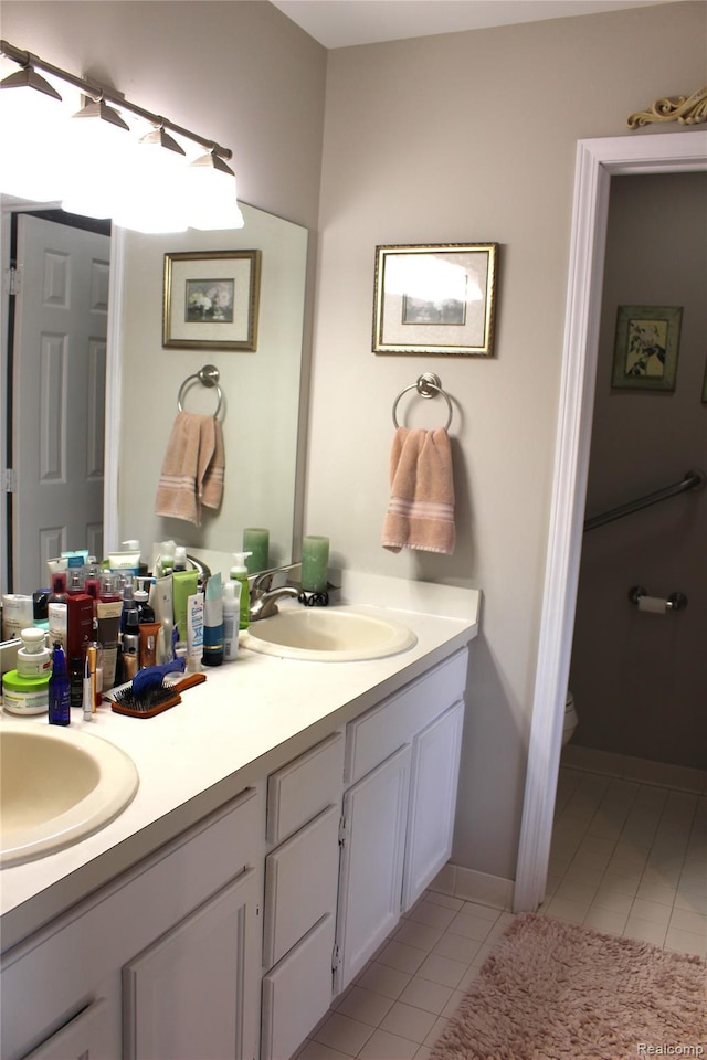 14361 Blue Heron Dr, Fenton, MI 48430 - bathroom featuring double vanity and tile patterned floors