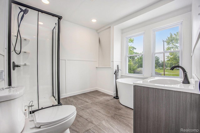 2934 Virginia Park St, Livonia, MI 48206 - bathroom with a stall shower, a soaking tub, a wainscoted wall, recessed lighting, and vanity