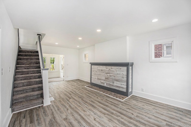2934 Virginia Park St, Livonia, MI 48206 - unfurnished living room featuring wood finished floors, recessed lighting, and stairway