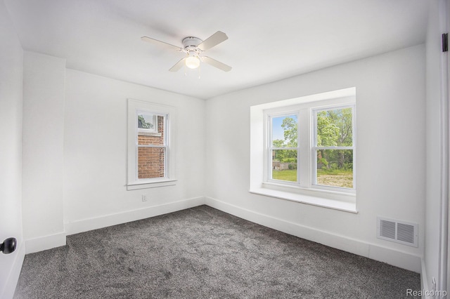 2934 Virginia Park St, Livonia, MI 48206 - empty room with healthy amount of natural light, dark colored carpet, and ceiling fan