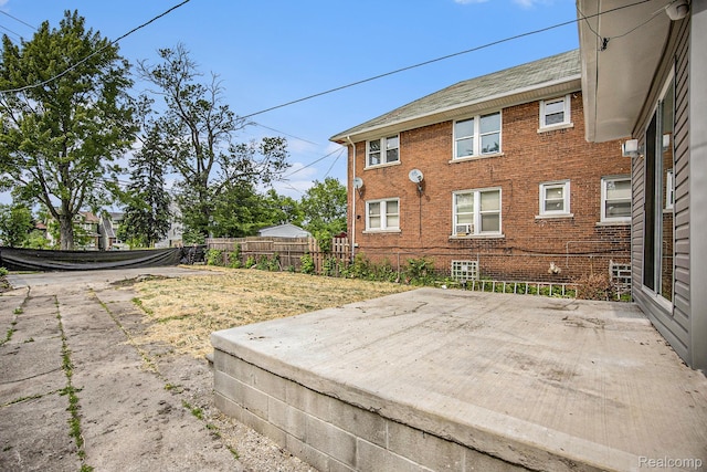 2934 Virginia Park St, Livonia, MI 48206 - back of house with brick siding and a patio area