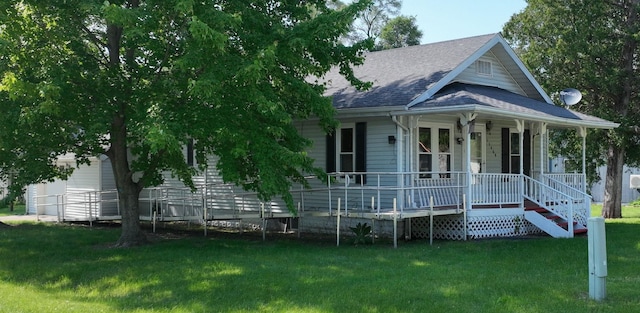 11469 Haven St, Clio, MI 48420 - view of front of home with covered porch, roof with shingles, and a front lawn