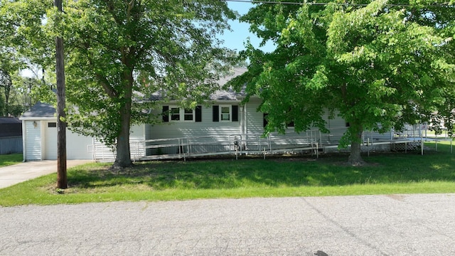 11469 Haven St, Clio, MI 48420 - view of front facade with concrete driveway, a front lawn, and an attached garage