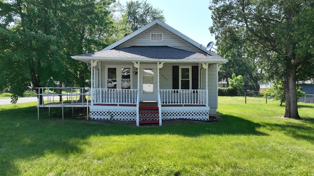 11469 Haven St, Clio, MI 48420 - view of front of house featuring covered porch, a shingled roof, and a front yard