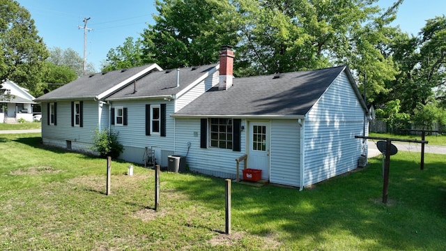 11469 Haven St, Clio, MI 48420 - rear view of property with a chimney and a shingled roof