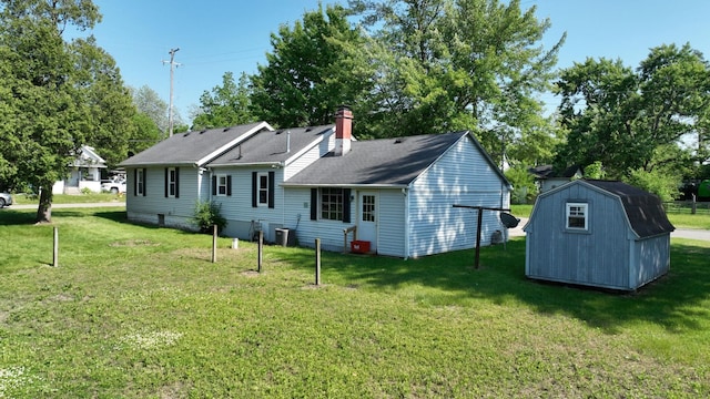 11469 Haven St, Clio, MI 48420 - rear view of property with a shed, a lawn, and a chimney