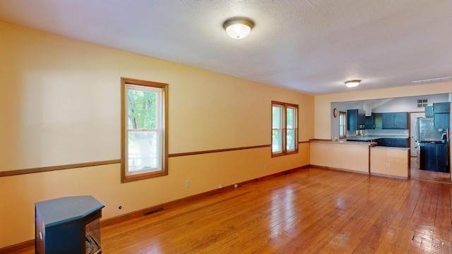 11469 Haven St, Clio, MI 48420 - unfurnished living room featuring light wood-type flooring