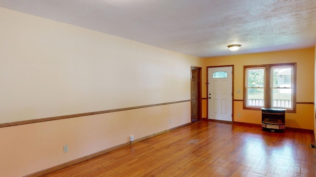 11469 Haven St, Clio, MI 48420 - empty room with light wood-style flooring and baseboards