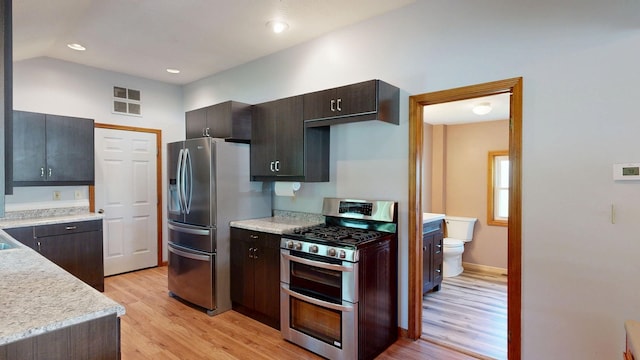 11469 Haven St, Clio, MI 48420 - kitchen featuring stainless steel appliances, light wood finished floors, light countertops, dark brown cabinets, and recessed lighting