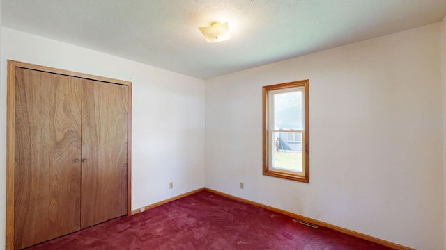 11469 Haven St, Clio, MI 48420 - unfurnished bedroom featuring carpet and a closet