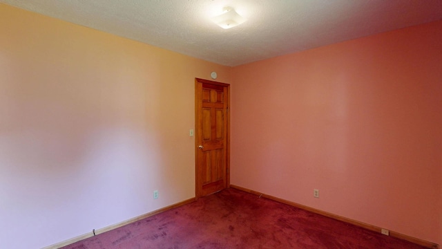 11469 Haven St, Clio, MI 48420 - empty room with dark carpet and baseboards