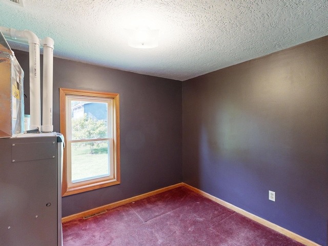 11469 Haven St, Clio, MI 48420 - carpeted spare room featuring a textured ceiling and baseboards