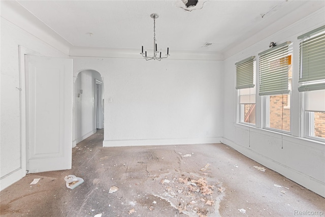 17327 Indiana St, Detroit, MI 48221 - spare room featuring arched walkways and a chandelier