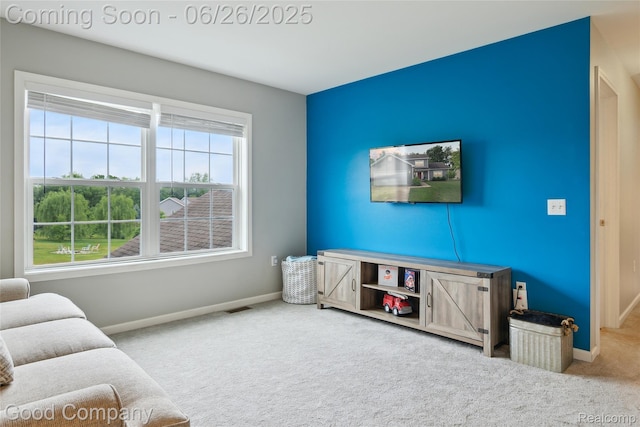 1123 Tartan Ln, Walled Lake, MI 48390 - living room featuring carpet and baseboards