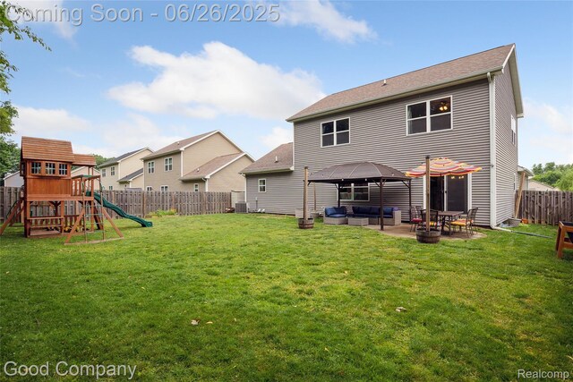 1123 Tartan Ln, Walled Lake, MI 48390 - back of house featuring a playground, an outdoor hangout area, a gazebo, a fenced backyard, and a patio