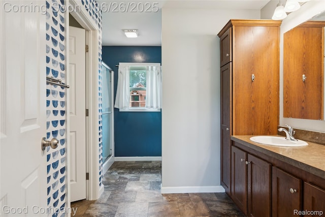 1123 Tartan Ln, Walled Lake, MI 48390 - full bathroom featuring vanity, stone finish floors, and a shower stall