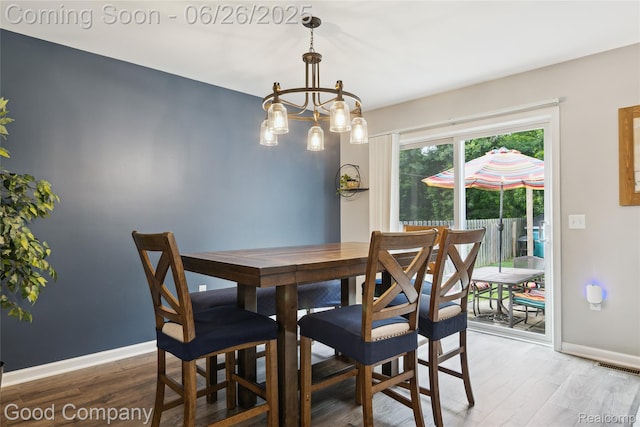 1123 Tartan Ln, Walled Lake, MI 48390 - dining area featuring light wood-type flooring and a chandelier