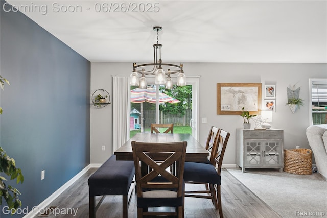 1123 Tartan Ln, Walled Lake, MI 48390 - dining room featuring wood finished floors and a chandelier