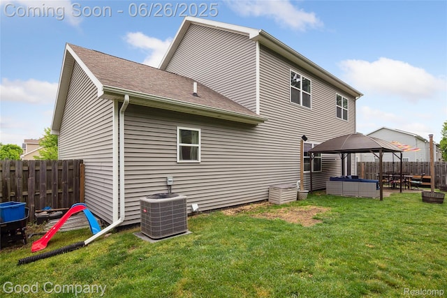 1123 Tartan Ln, Walled Lake, MI 48390 - back of house featuring a gazebo, a patio, an outdoor hangout area, and a shingled roof