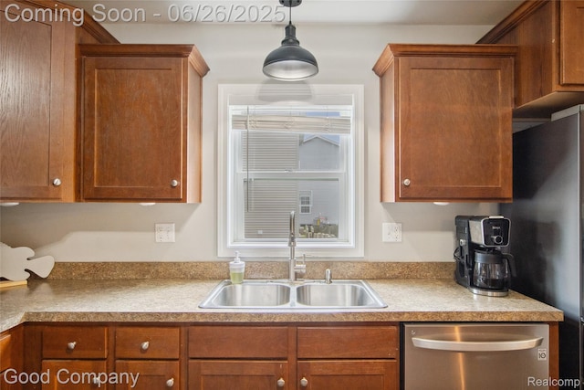 1123 Tartan Ln, Walled Lake, MI 48390 - kitchen with stainless steel dishwasher, brown cabinetry, pendant lighting, and light countertops
