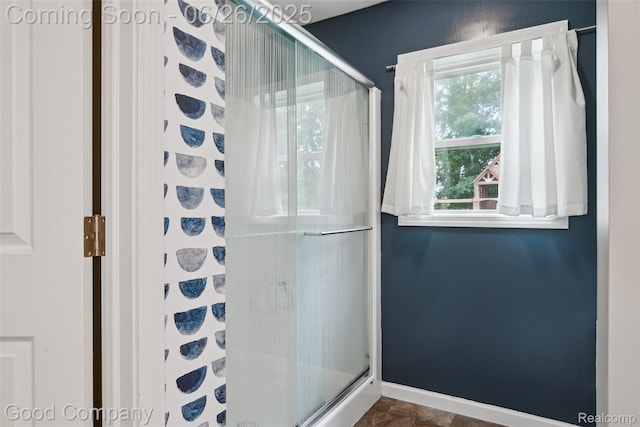 1123 Tartan Ln, Walled Lake, MI 48390 - bathroom featuring a shower stall and baseboards
