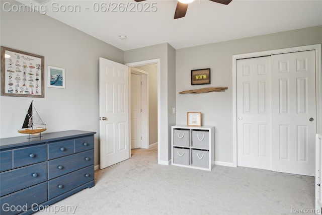 1123 Tartan Ln, Walled Lake, MI 48390 - bedroom with light carpet, a closet, and a ceiling fan