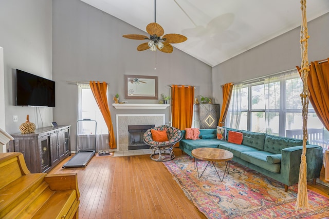 4315 Knollcrest Dr, Ann Arbor, MI 48108 - living room featuring high vaulted ceiling, plenty of natural light, a ceiling fan, hardwood / wood-style floors, and a fireplace