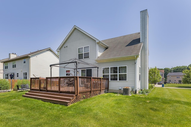 4315 Knollcrest Dr, Ann Arbor, MI 48108 - back of property with a wooden deck, a yard, a chimney, and a shingled roof