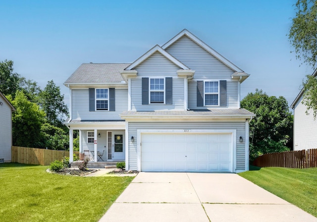 4315 Knollcrest Dr, Ann Arbor, MI 48108 - traditional-style house with covered porch, an attached garage, and driveway