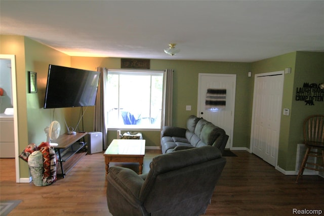 12850 E Rd, Burt, MI 48417 - living room with wood finished floors and washer / dryer