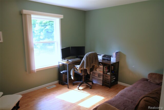 12850 E Rd, Burt, MI 48417 - office space featuring wood finished floors and baseboards