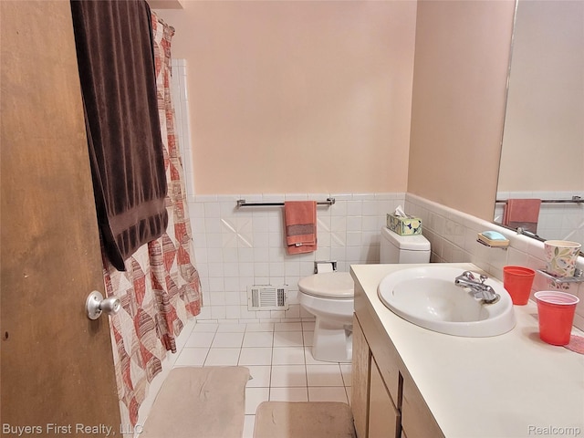 26001 Harding Sq, Oak Park, MI 48237 - bathroom featuring wainscoting, vanity, tile patterned flooring, a shower with shower curtain, and tile walls