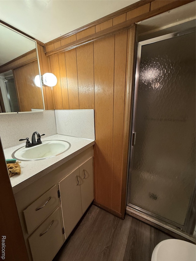 1321 Rainbow Dr, Saginaw, MI 48638 - full bathroom featuring vanity, wood finished floors, and a stall shower