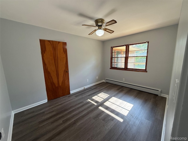 1321 Rainbow Dr, Saginaw, MI 48638 - spare room with baseboard heating, dark wood-type flooring, and a ceiling fan