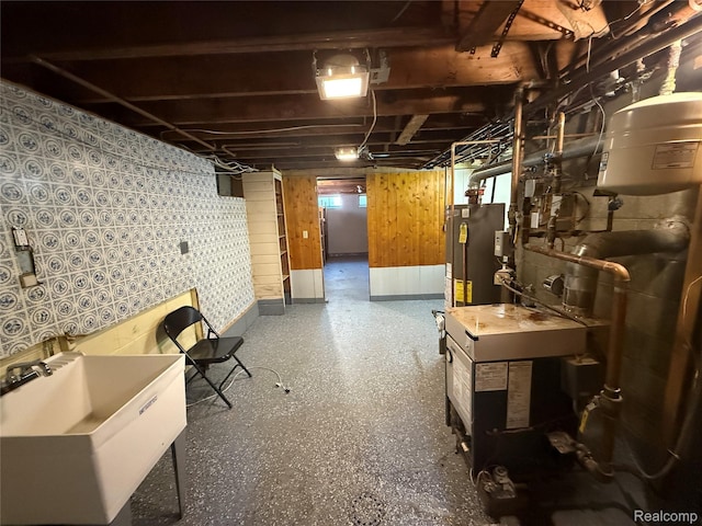 1321 Rainbow Dr, Saginaw, MI 48638 - unfinished below grade area with a sink and gas water heater
