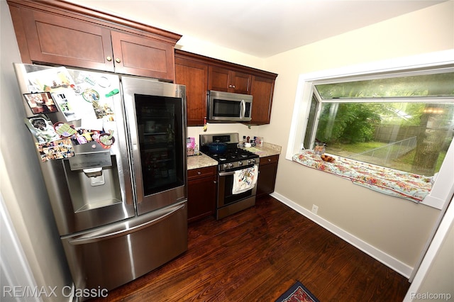 1924 Pinecrest Dr, Ferndale, MI 48220 - kitchen with appliances with stainless steel finishes, dark wood finished floors, and light stone countertops