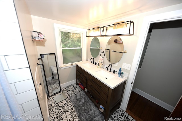 1924 Pinecrest Dr, Ferndale, MI 48220 - full bathroom featuring double vanity and toilet
