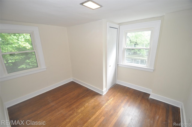 1924 Pinecrest Dr, Ferndale, MI 48220 - unfurnished room with dark wood-style flooring and baseboards