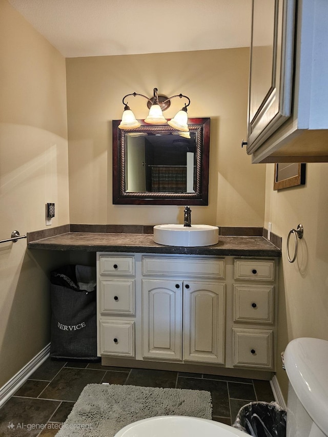 1005 W Lake St, Tawas City, MI 48763 - bathroom featuring baseboards and vanity