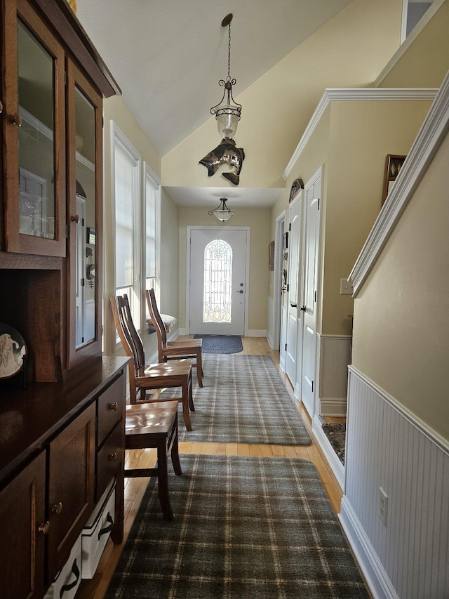 1005 W Lake St, Tawas City, MI 48763 - foyer entrance featuring wainscoting and lofted ceiling