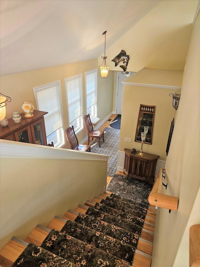 1005 W Lake St, Tawas City, MI 48763 - staircase with wood finished floors and lofted ceiling