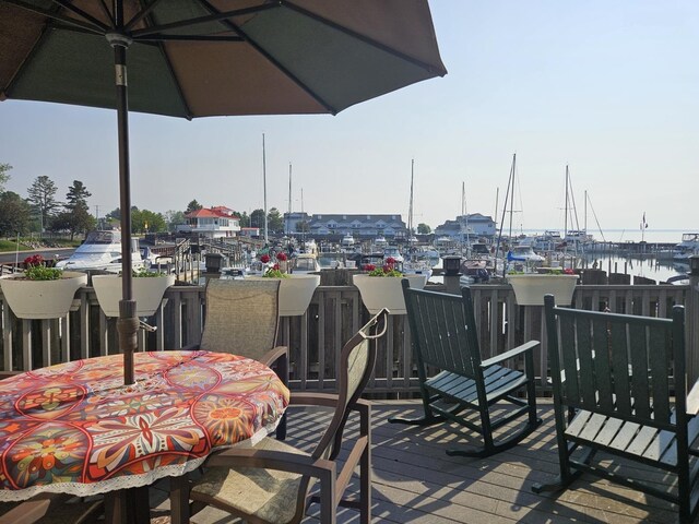 1005 W Lake St, Tawas City, MI 48763 - deck with a water view and view of marina