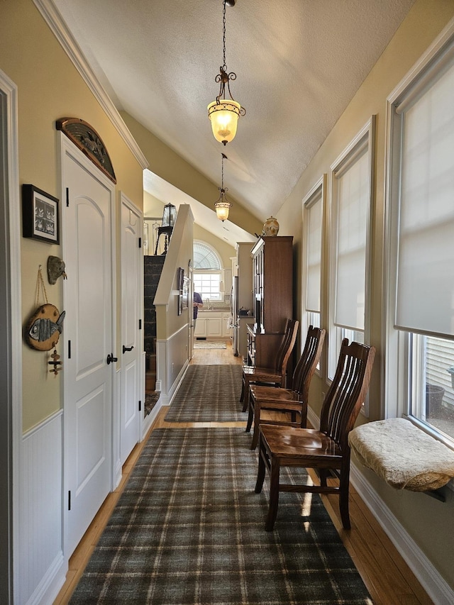 1005 W Lake St, Tawas City, MI 48763 - sitting room featuring a textured ceiling, wood finished floors, and vaulted ceiling