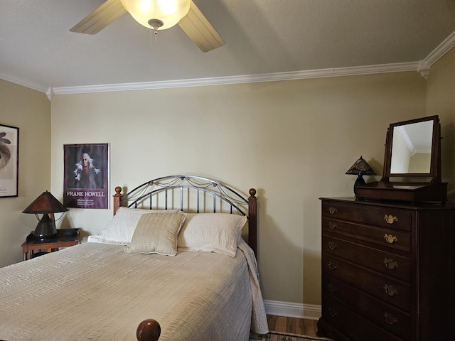 1005 W Lake St, Tawas City, MI 48763 - bedroom featuring ornamental molding, ceiling fan, and wood finished floors