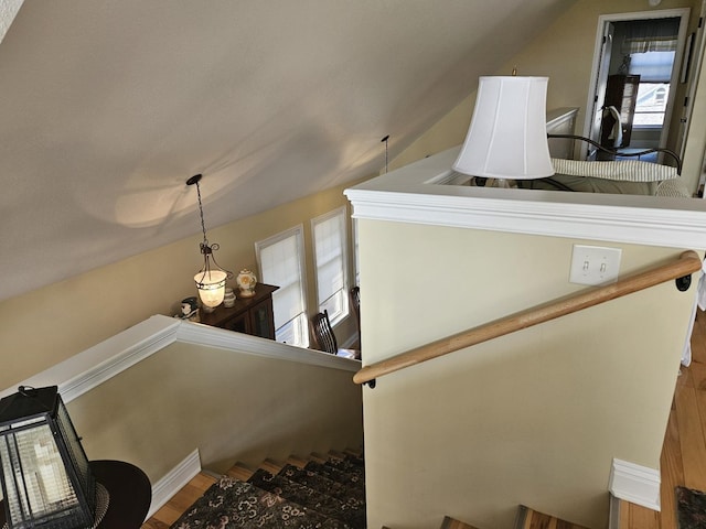 1005 W Lake St, Tawas City, MI 48763 - staircase featuring lofted ceiling, plenty of natural light, and wood finished floors