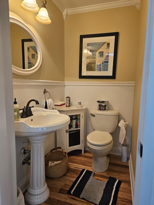 1005 W Lake St, Tawas City, MI 48763 - half bath with wood finished floors, a wainscoted wall, and crown molding